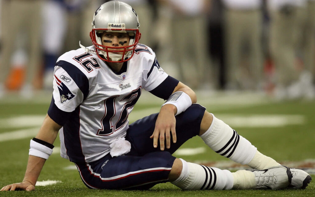 Iconic Tom Brady Wallpaper: Focused Leadership on the Field