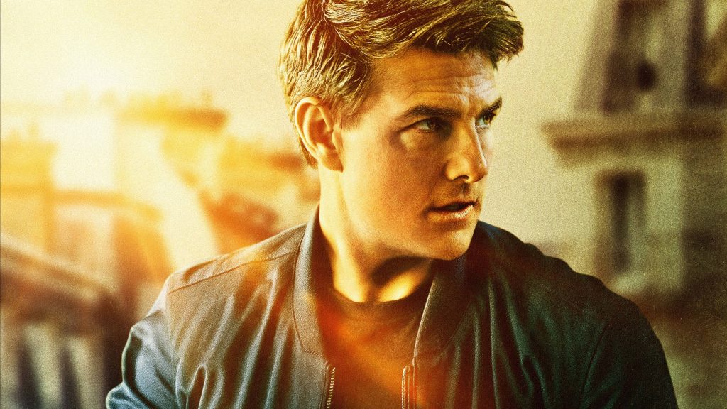 Tom Cruise intense gaze sunset glow dark bomber jacket cinematic desktop wallpaper background