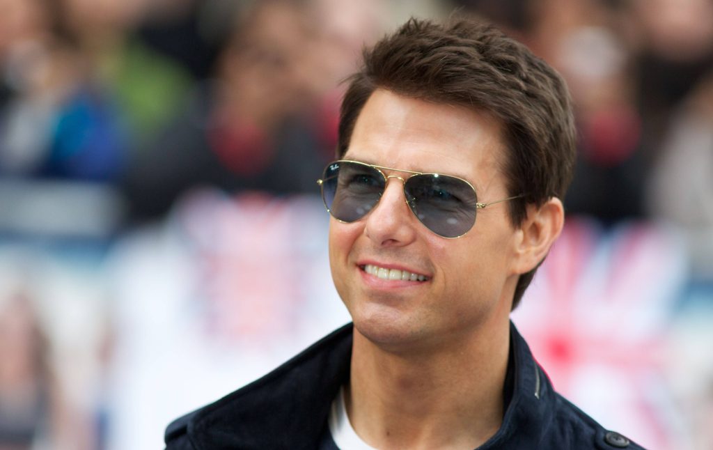 Tom Cruise wearing Ray-Ban Aviator sunglasses dark jacket smiling stylish wallpaper background