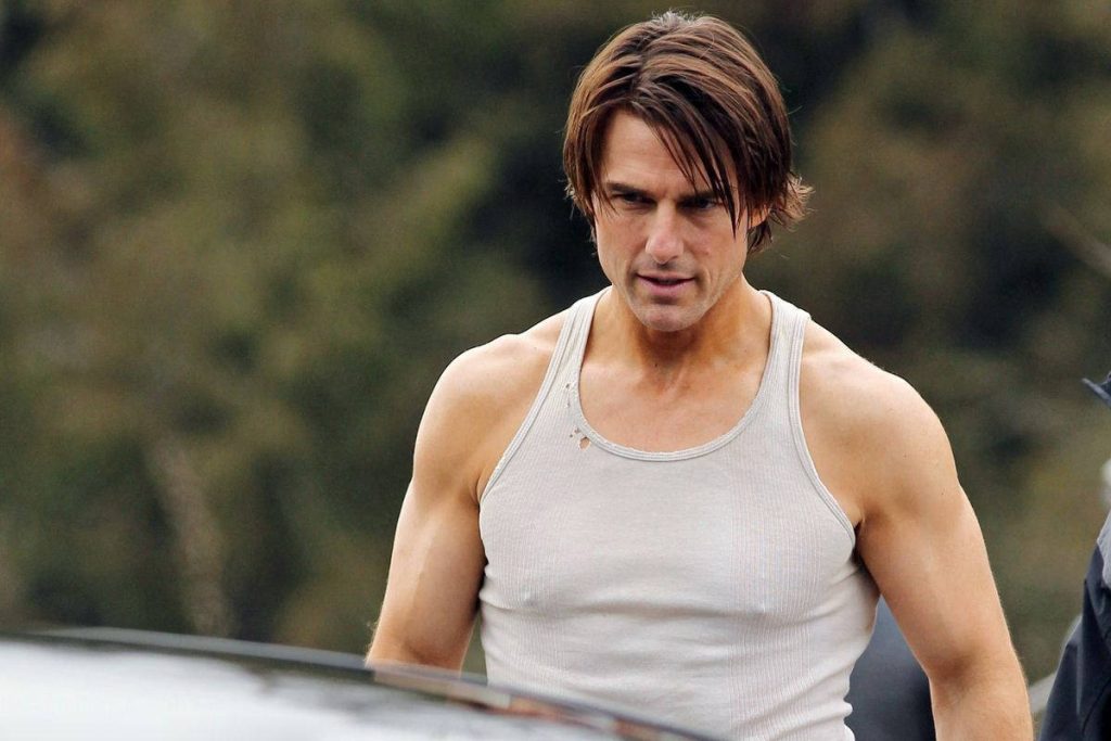 Tom Cruise intense action look in rugged white tank top outdoor cinematic HD wallpaper