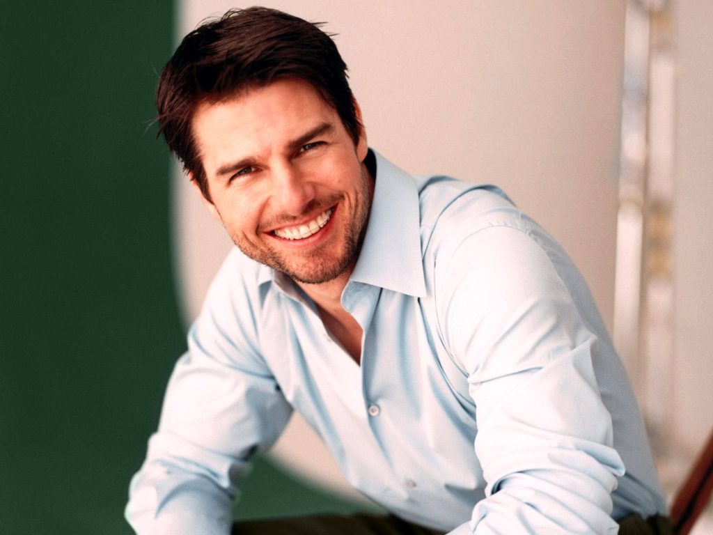 Tom Cruise smiling in light blue shirt studio portrait bright clean background HD wallpaper