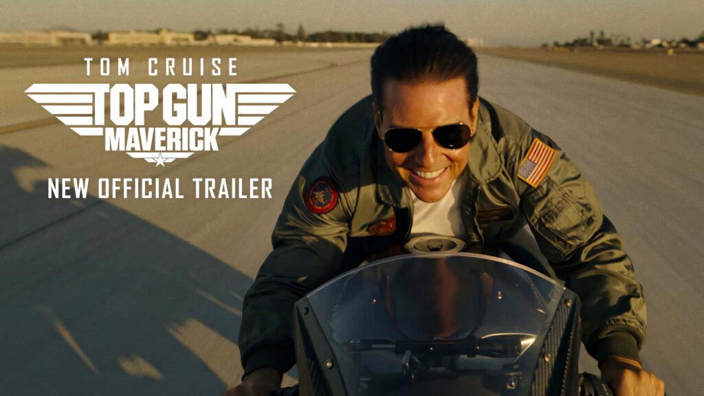 Tom Cruise as Pete Mitchell in pilot uniform speeding down runway Top Gun Maverick wallpaper