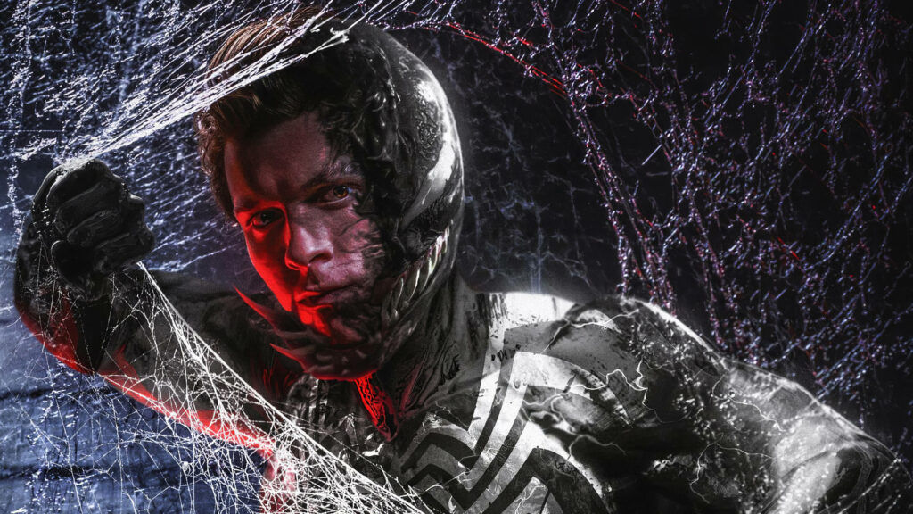 Marvel's Dark Redemption: Tom Hardy's Venom Hunts Carnage amidst Webbed Obscurity Wallpaper