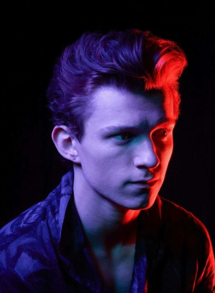 Tom Holland portrait with vibrant neon lights sharp features dramatic modern wallpaper background
