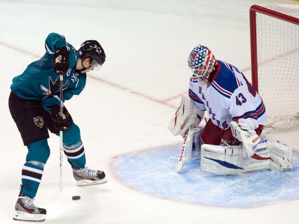 Tomas Hertl Winning Goal Wallpaper: Intense Hockey Action Background