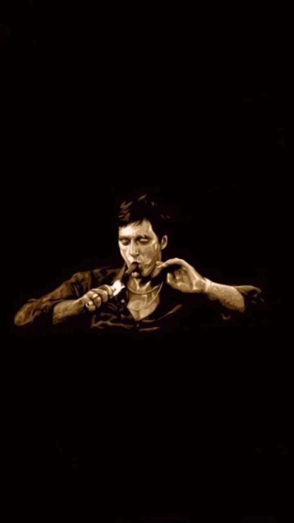 Tony Montana intense Scarface dark dramatic scene sitting black background iconic wallpaper