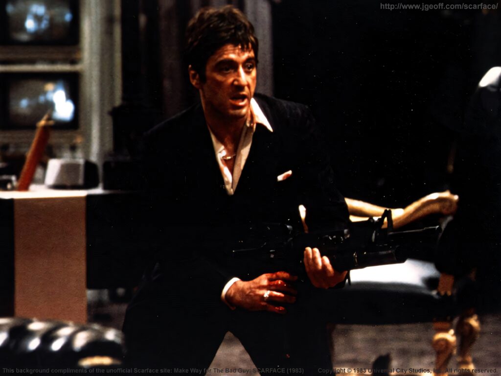 Tony Montana gripping gun intense dramatic Scarface iconic wallpaper for classic film fans