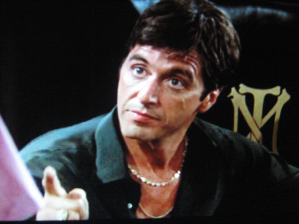Tony Montana seated on throne Scarface movie iconic wallpaper power intensity background