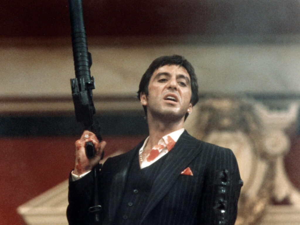 Tony Montana holding gun defiantly iconic Scarface wallpaper intense classic film scene