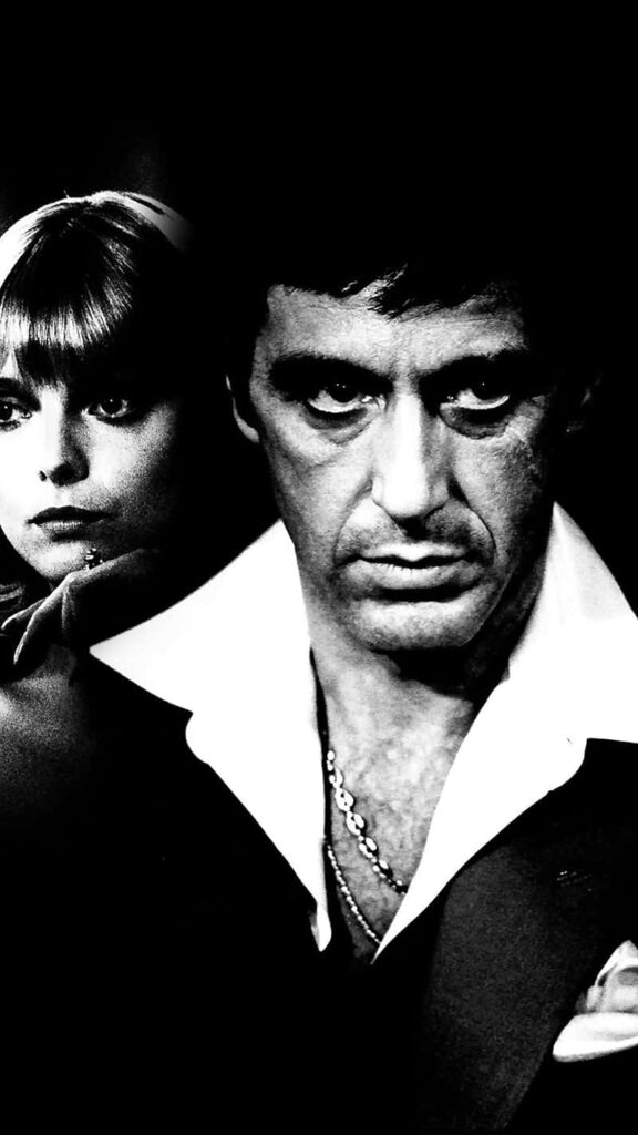 Tony Montana intense expression with key character Scarface iconic crime drama wallpaper background