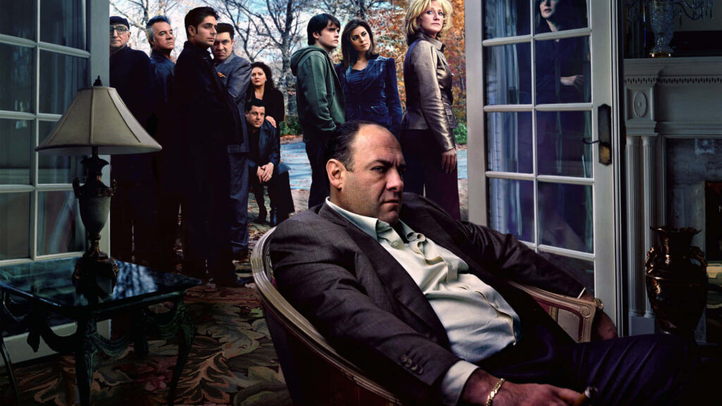 Contemplative Tony Soprano Wallpaper with Ensemble Cast Background