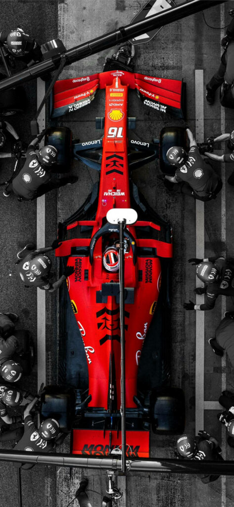 Ferrari's High-Speed Symphony: A Spectacular Aerial Shot of Scuderia's Formula One Beast Wallpaper