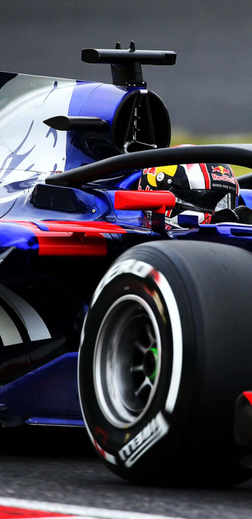 Toro Rosso STR12 2018 Formula 1 car close-up with blue and red livery racing on track wallpaper