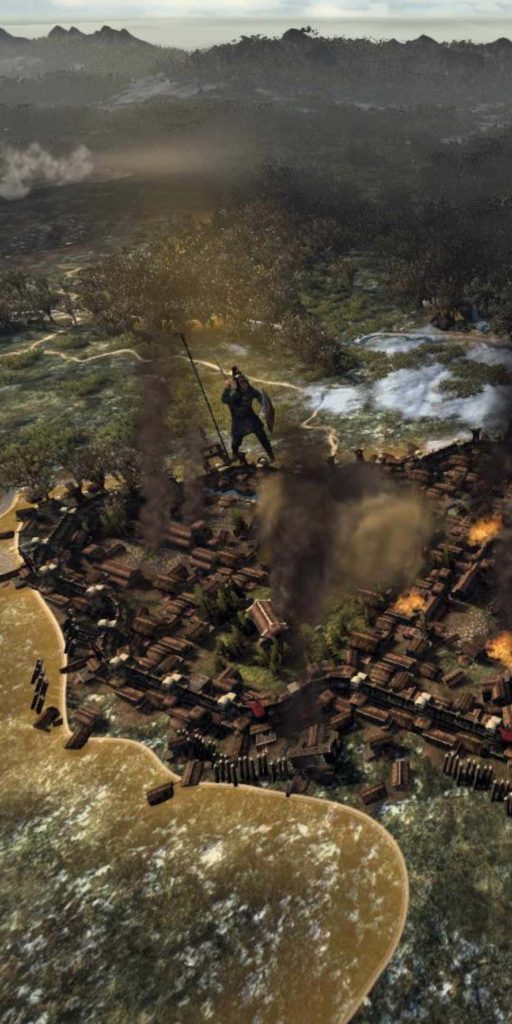 Overhead map of Total War Attila with lone warrior guarding burning settlement in dark war scene Wallpaper