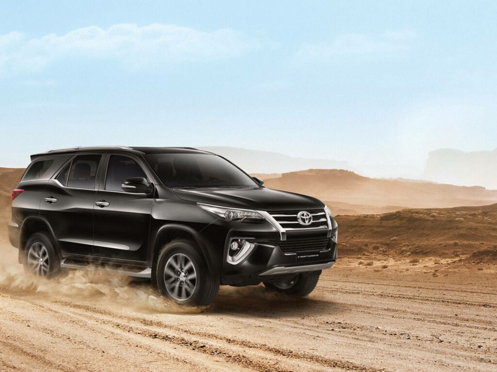 Toyota Fortuner Attitude Black driving rugged desert terrain bold SUV adventure wallpaper