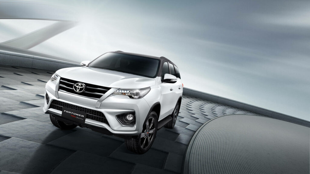 White Toyota Fortuner TRD parked with futuristic background highlighting sporty bold design Wallpaper