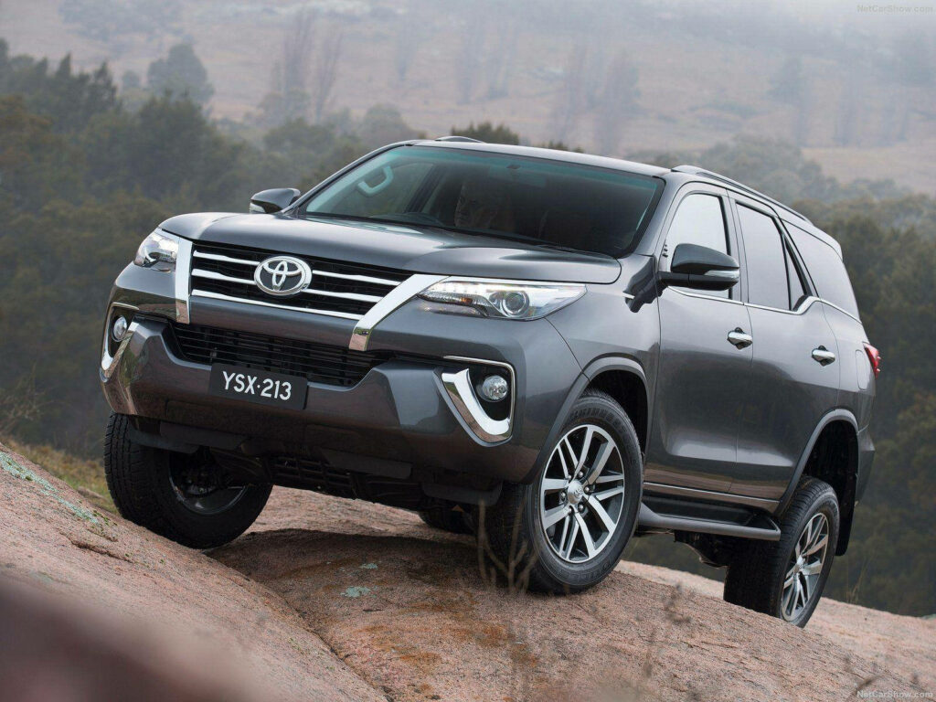 Toyota Fortuner VRZ gray metallic on rocky terrain showcasing rugged off-road SUV design wallpaper