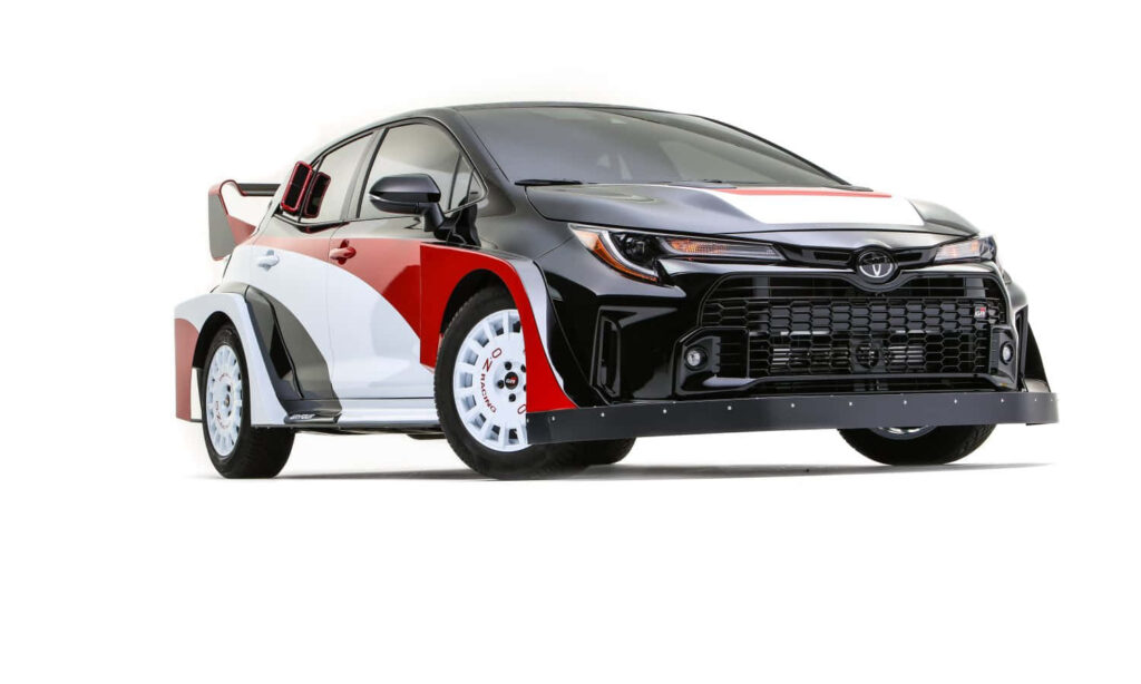 Sporty Toyota rally car wallpaper with black red white livery and white OZ Racing wheels