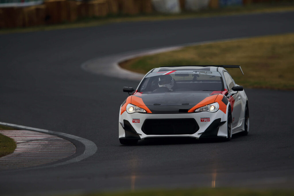 Toyota TRD 86 SE racing on curved track showing sporty design and performance enhancements Wallpaper