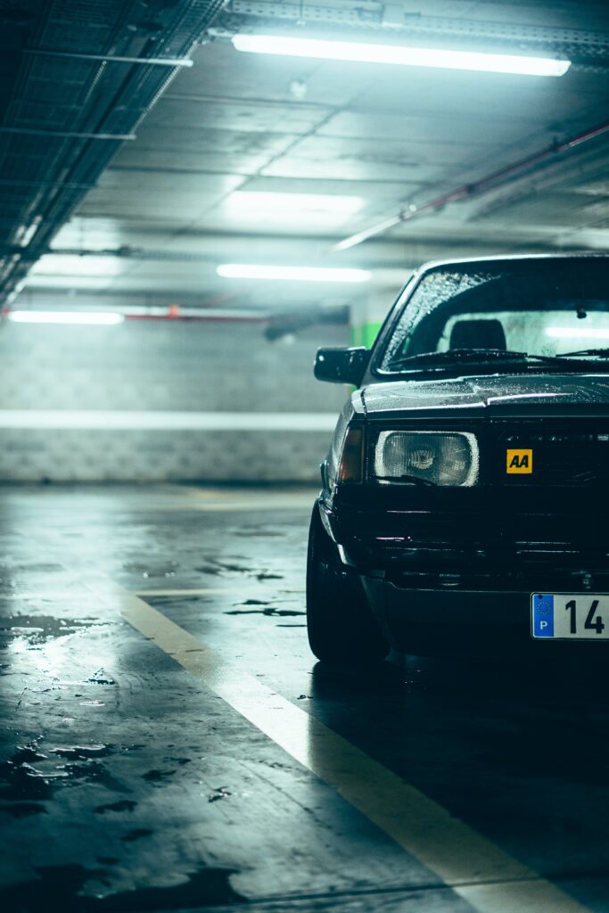 Toyota bB Front View in Dimly Lit Parking Garage Wallpaper