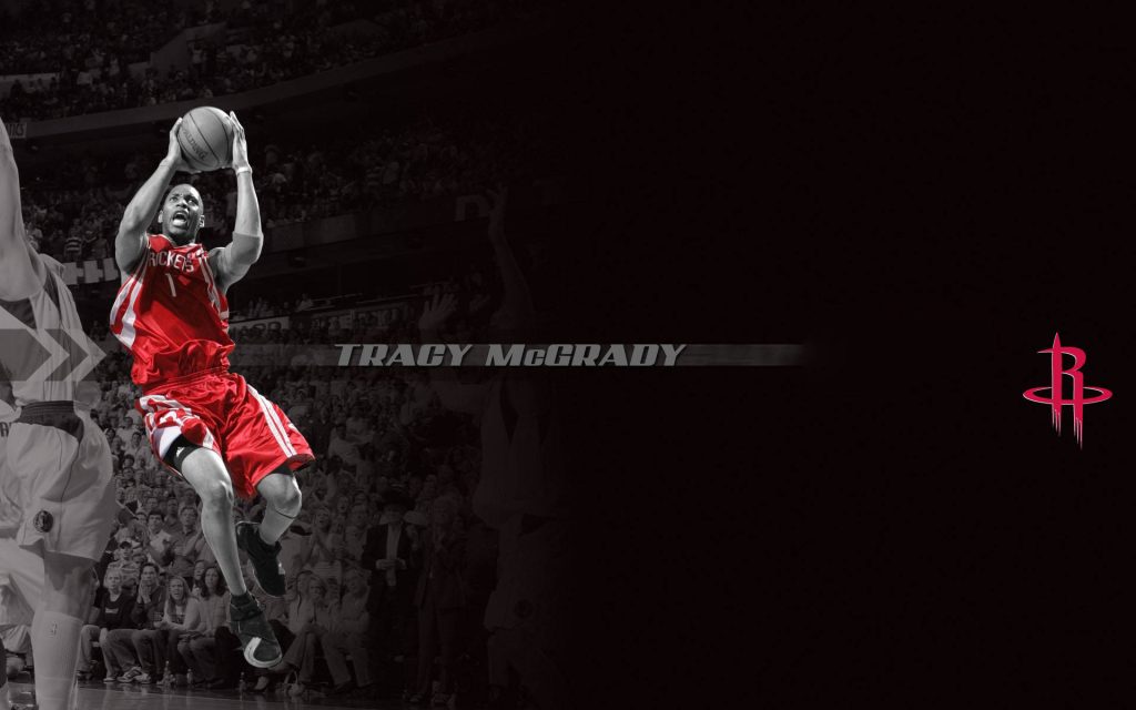 Tracy McGrady Houston Rockets NBA wallpaper action shot with team logo on dark arena background