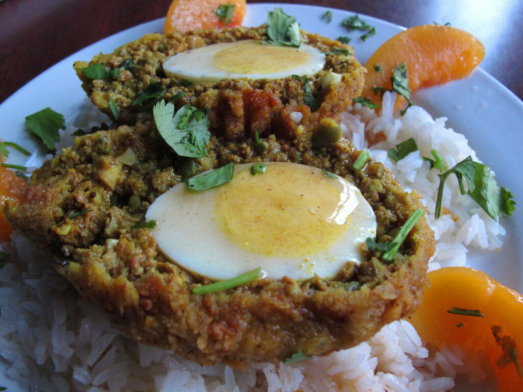 Scotch Egg Delight: Traditional Dish on Fragrant Rice - Wallpaper Background