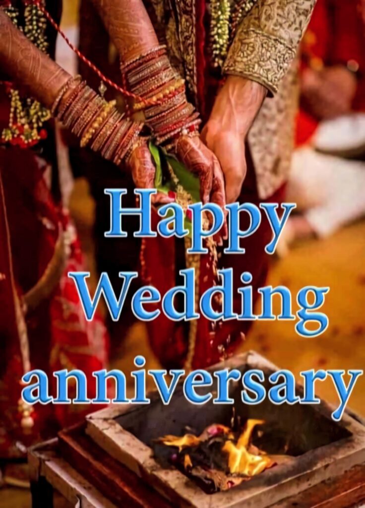 Traditional wedding ceremony couple performing rituals with Happy Wedding Anniversary text wallpaper