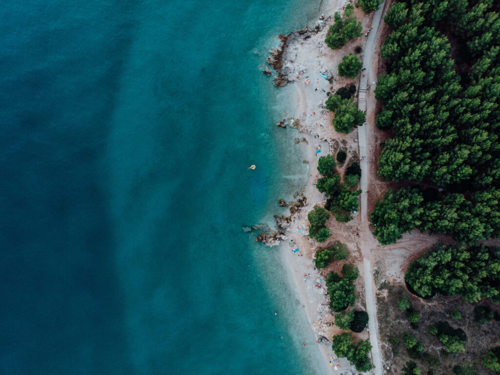 Serene Coastal Aerial Wallpaper: Relaxing Beach & Turquoise Waters