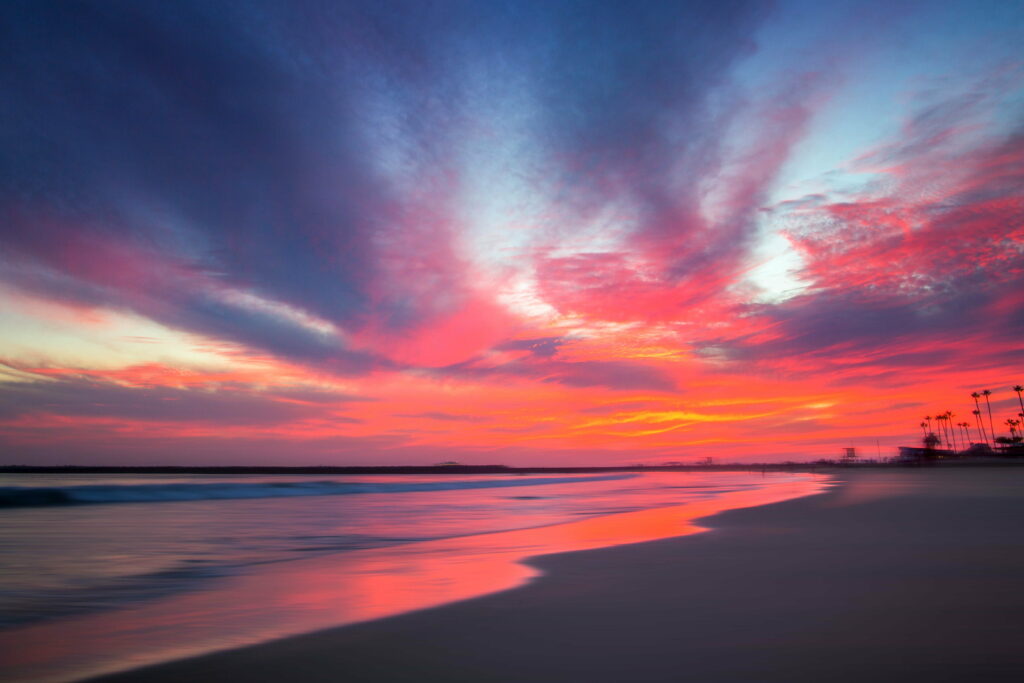 Stunning Serene Beach Sunset Wallpaper - Tranquil Long Exposure Scene