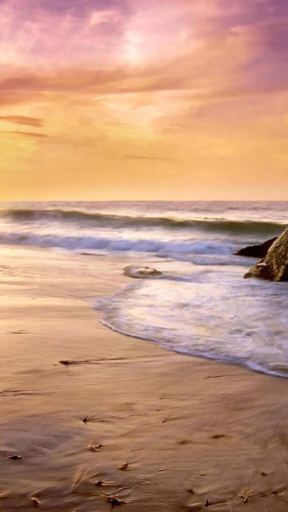 Tranquil Beach Scene: Gentle Waves & Golden Sunset Background Wallpaper