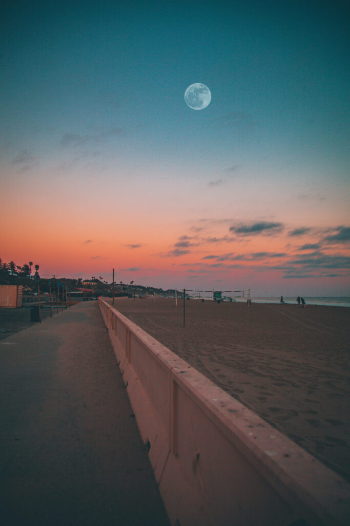 Tranquil Beach Sunset Wallpaper: Serene Road & Full Moon Scene