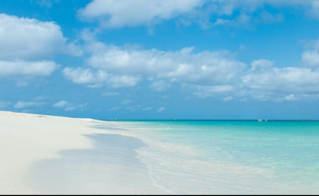 Serene Beach Wallpaper: Pristine Sand & Turquoise Waters Background