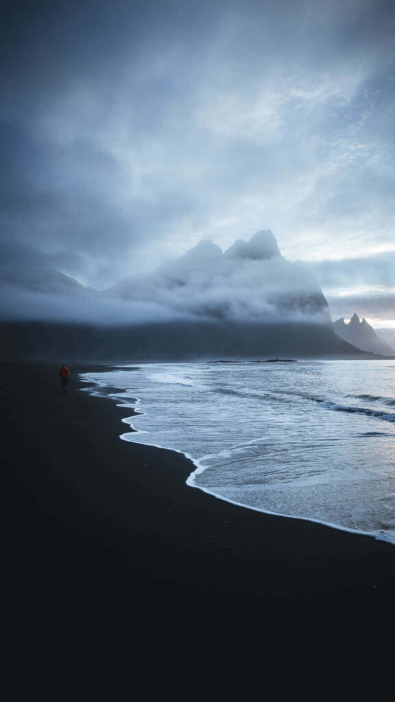 Tranquil Beach Wallpaper: Misty Mountains & Serene Paradise Background