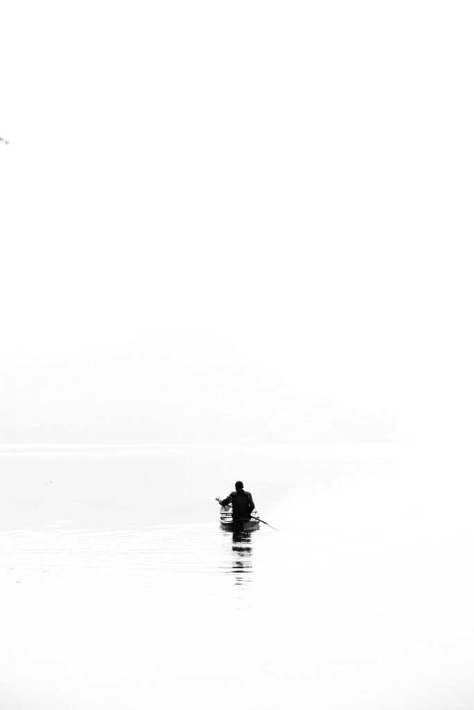 Serene Black and White Wallpaper: Minimalist Rowing Silhouette
