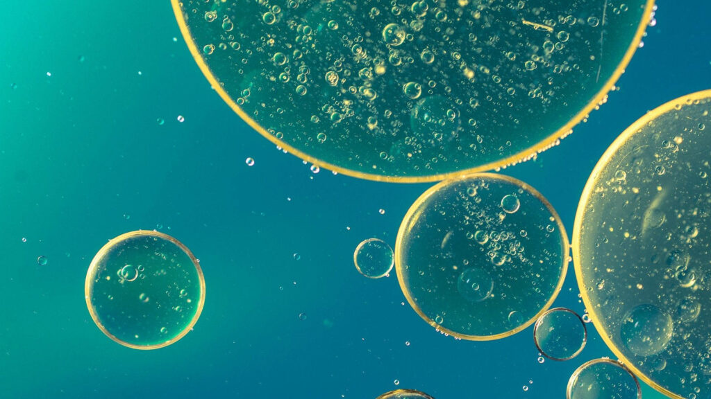 Tranquil Blue-Green Bubble Wallpaper: Mesmerizing Abstract Background