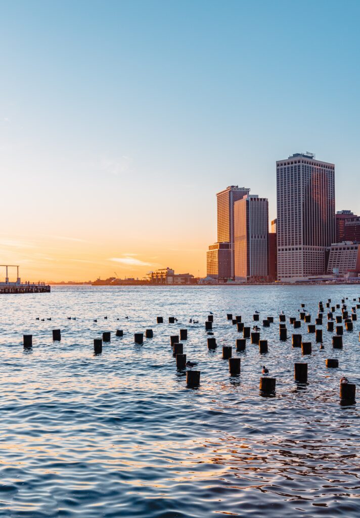 Tranquil Urban Sunset Wallpaper: Serene Cityscape & Calm River