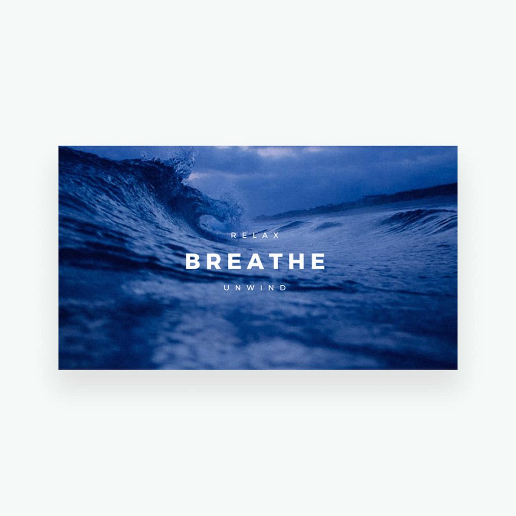 Crashing deep blue ocean wave at twilight with Relax Breathe Unwind text serene wallpaper background