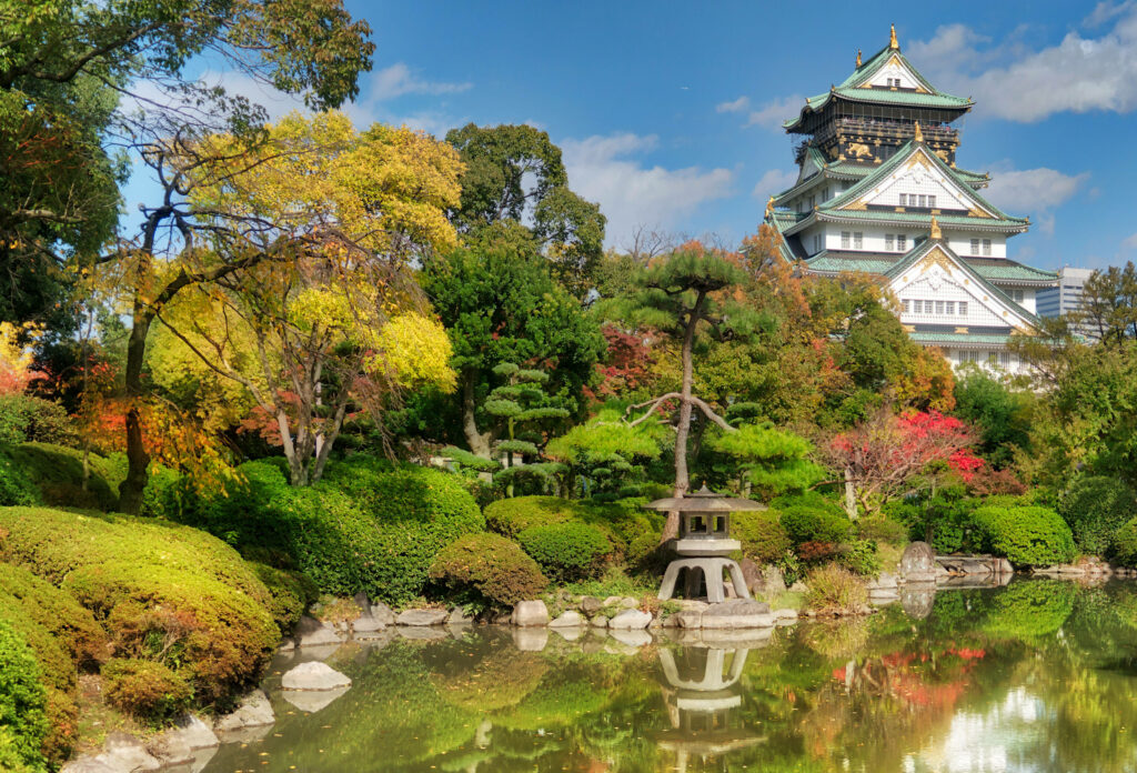 Serenity Embodied: Zen Garden Harmony with Majestic Osaka Castle Wallpaper