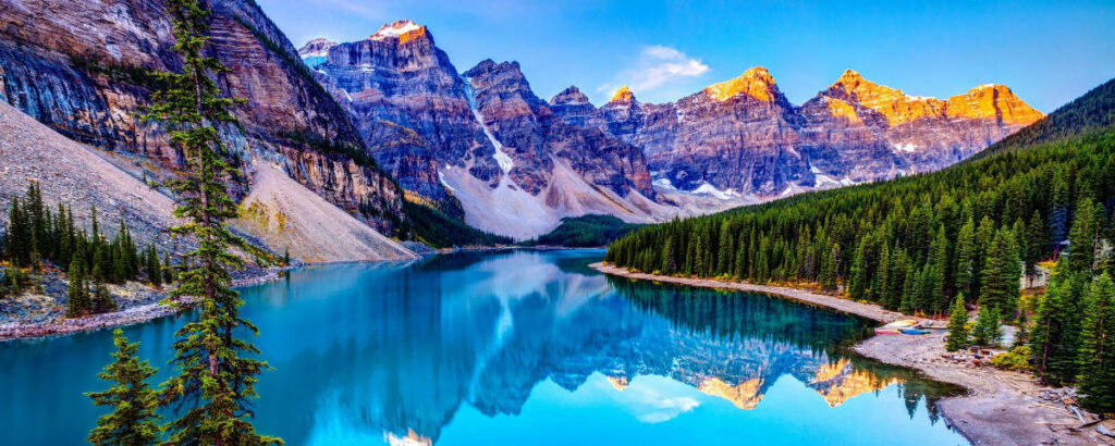 Tranquil Blue Lake Wallpaper Amidst Majestic Mountains & Pines