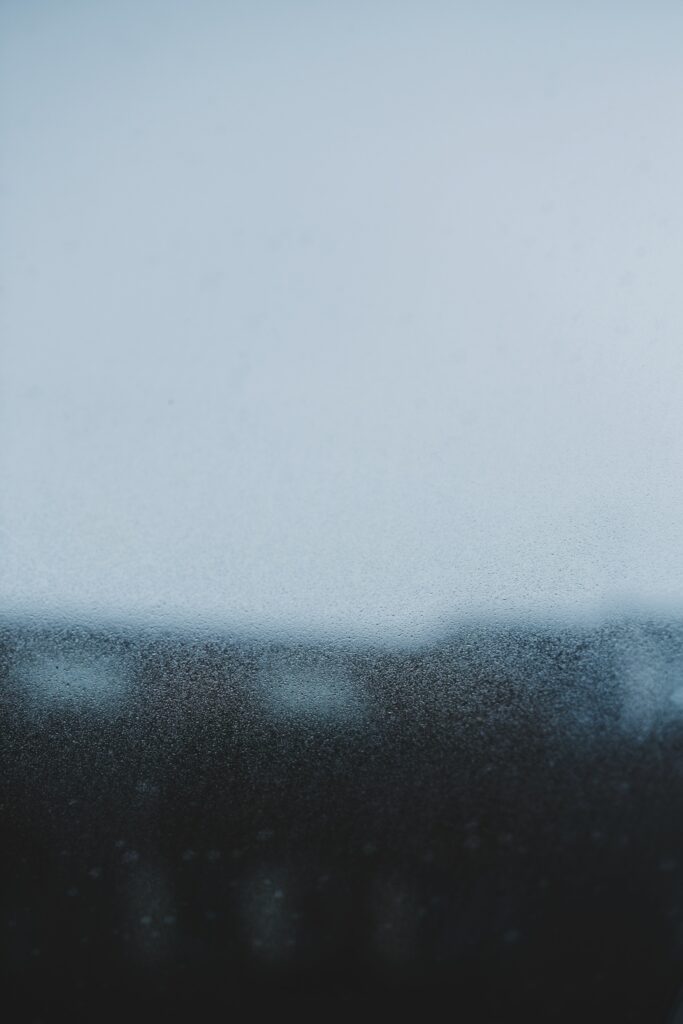 Serene Macro Wallpaper: Soft Water Drops on Glass Background