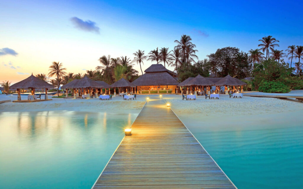 Tranquil Maldives Beach Wallpaper: Sunset Boardwalk & Huts