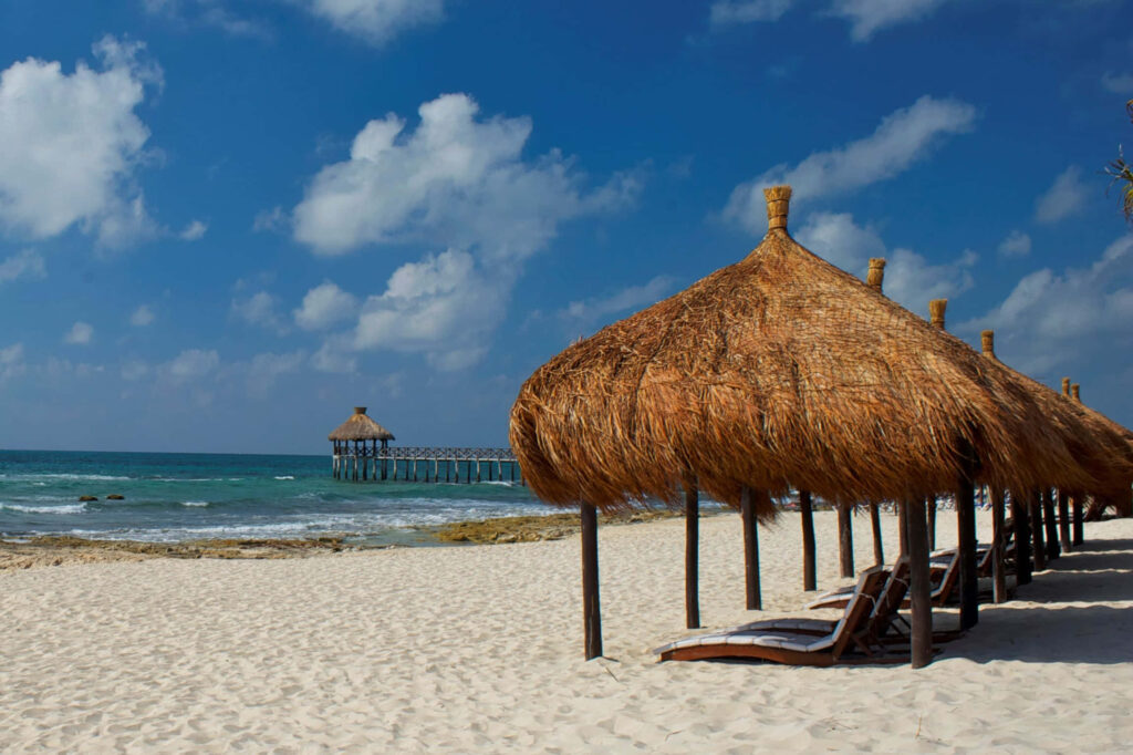 Serene Mexican Beach Wallpaper: White Sand & Rustic Palapas
