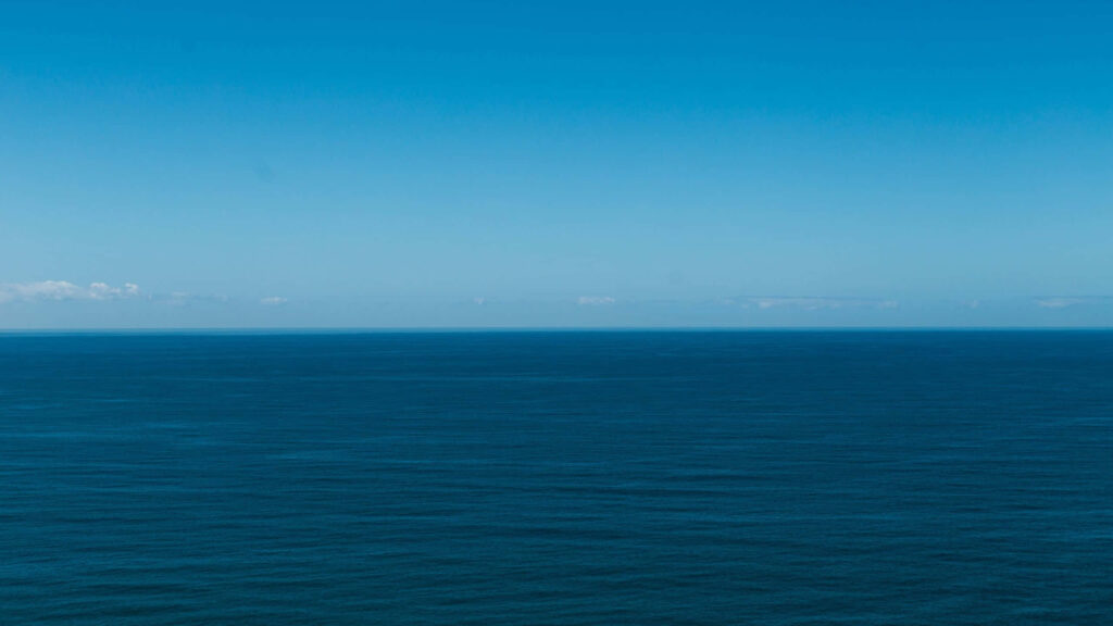 Tranquil Ocean View Wallpaper: Serene Deep Blue Background