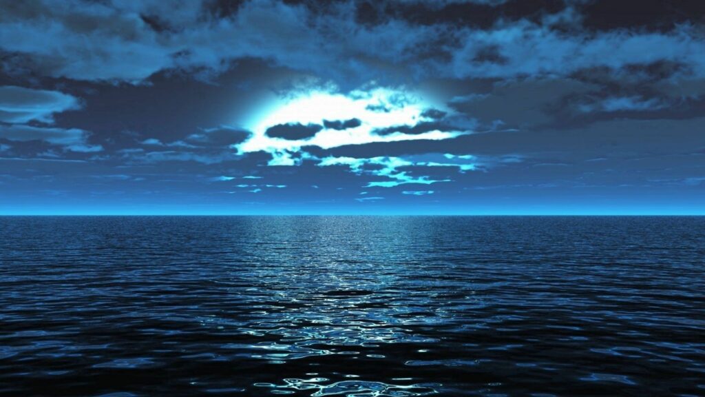 Serene night sea wallpaper with moonlight reflections on calm water and deep blue hues background