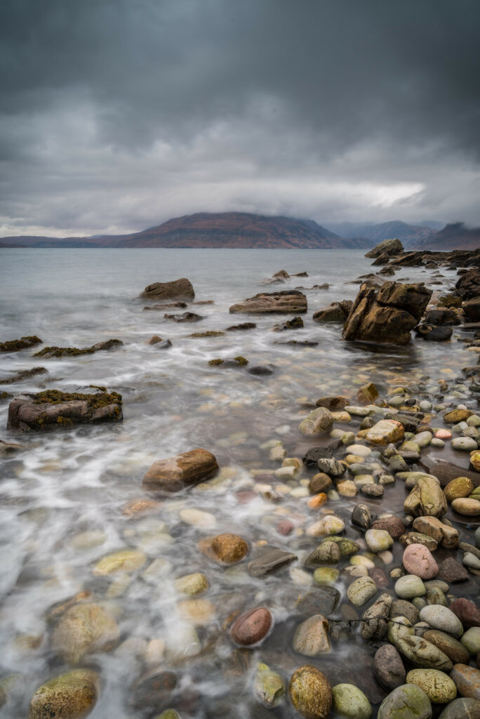 Serene mountain landscape with mist fog calm water colorful stones rugged rocks nature wallpaper