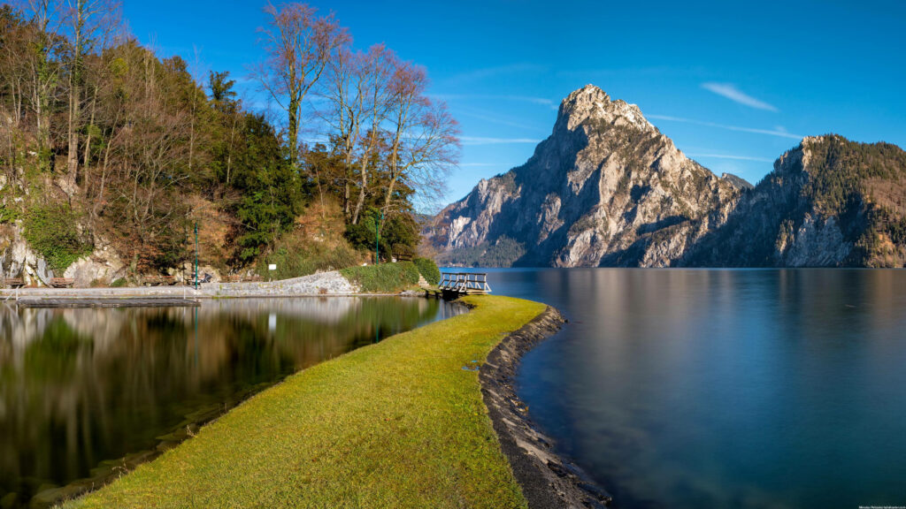 Transcendent Tranquility: Majestic Lake View with Serene Concrete Pathway for 3840x2160 Monitor Screens Wallpaper