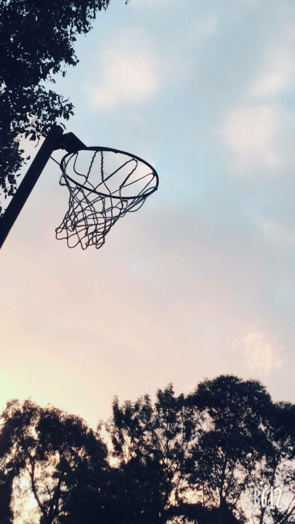 Tranquil Netball Ring Wallpaper at Sunset | Serene Sports Background