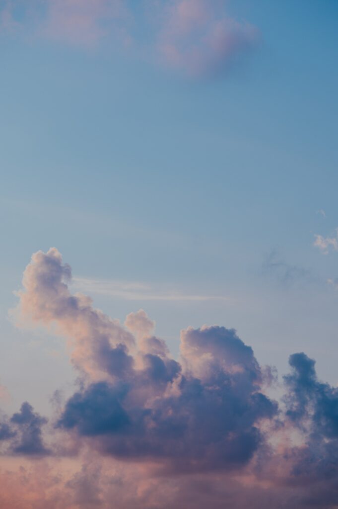 Serene pastel sky wallpaper with soft clouds creating a calm and tranquil background scene
