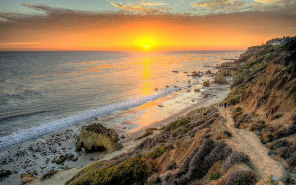 Captivating Malibu Sunset: An Elevated View of a Scenic Beach Path Wallpaper