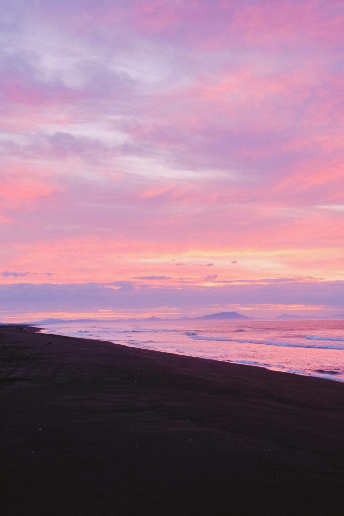 Tranquil Pink Sunset Beach Wallpaper for Android Background